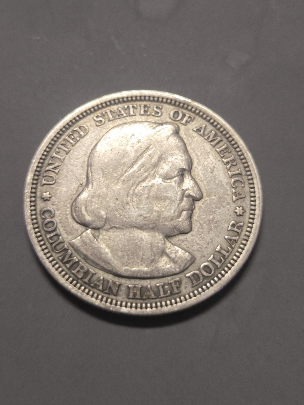 Columbian Half Dollar Silver-Toned Coin